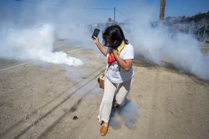 Protesters and federal agents clash during raid at Southern California farm